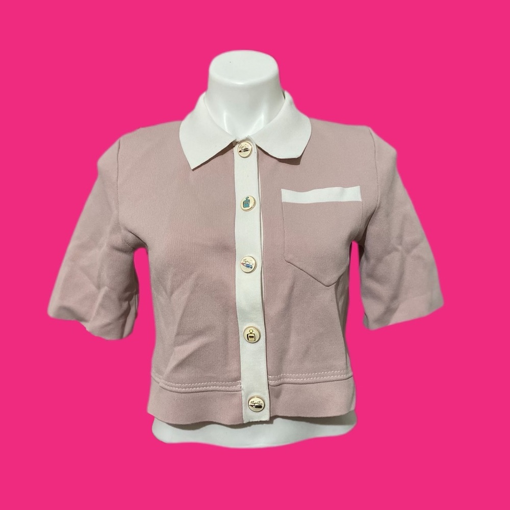 Maje cropped top with styled makeup buttons.